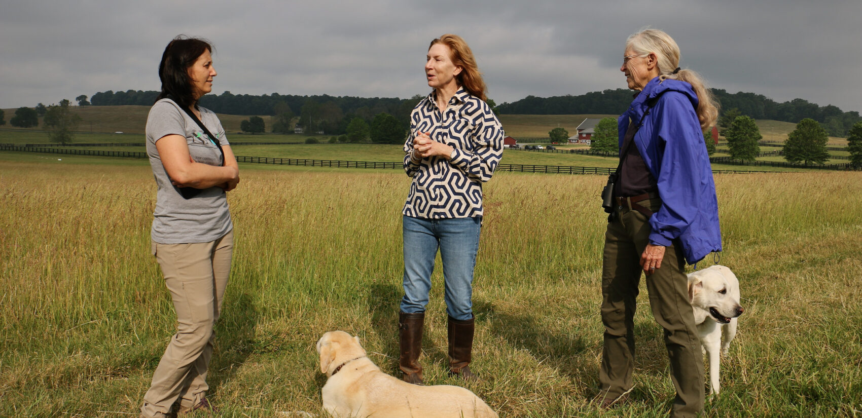 Zoë Warner, D.D. Matz and Starr Cummin Bright stand in a field