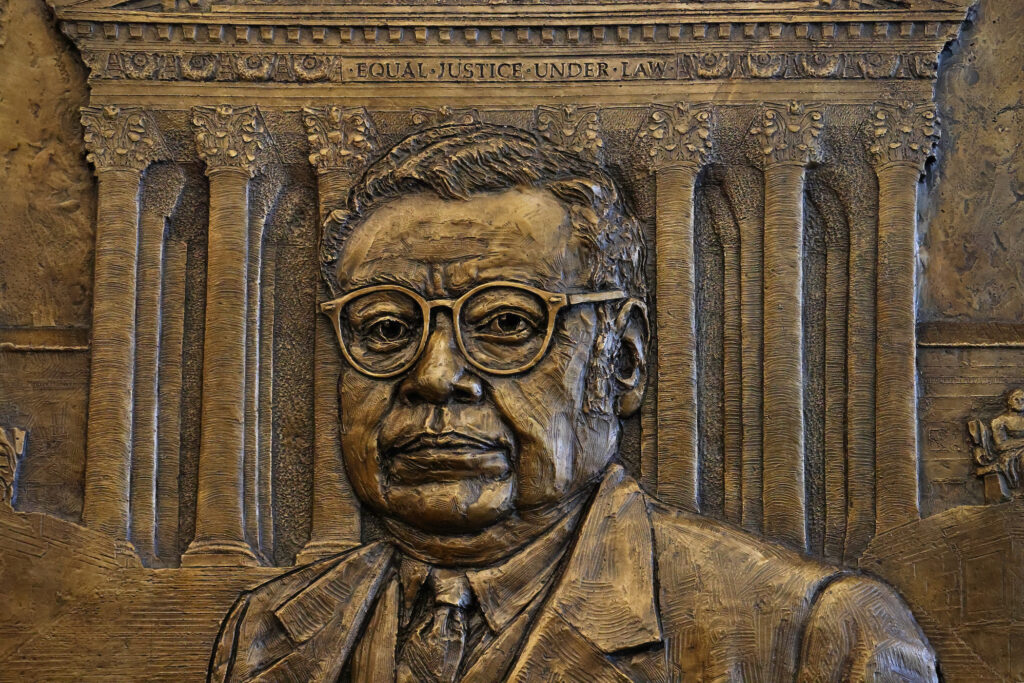 A closeup photo of the bas-relief portrait of William Thaddeus Coleman Jr.
