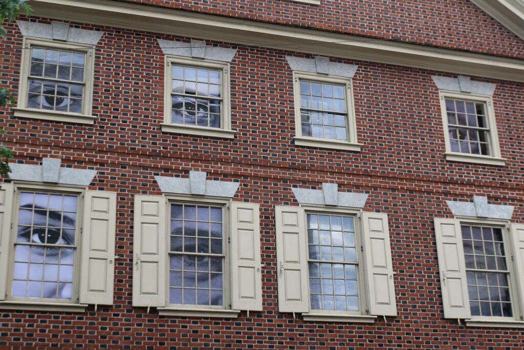 large eyes are seen through windows