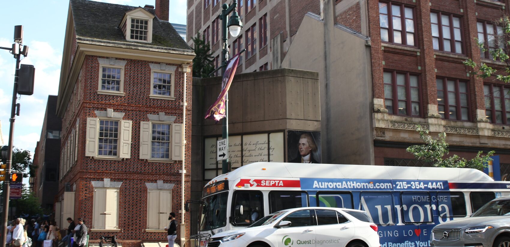 At the corner of Seventh and Market streets, passersby will witness Sonya Clark’s “The Descendants of Monticello”  through the windows of the Declaration House. (Cory Sharber/WHYY)