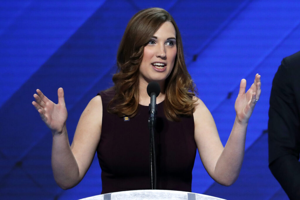 Sarah McBride speaking at a podium
