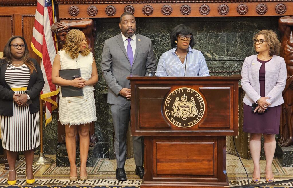 Mayor Parker speaking at a podium