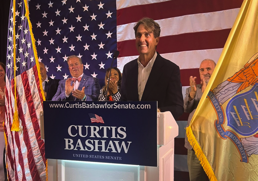 curtis-bashaw-primary-victory-2024-06-05 Curtis Bashaw speaking at a podium