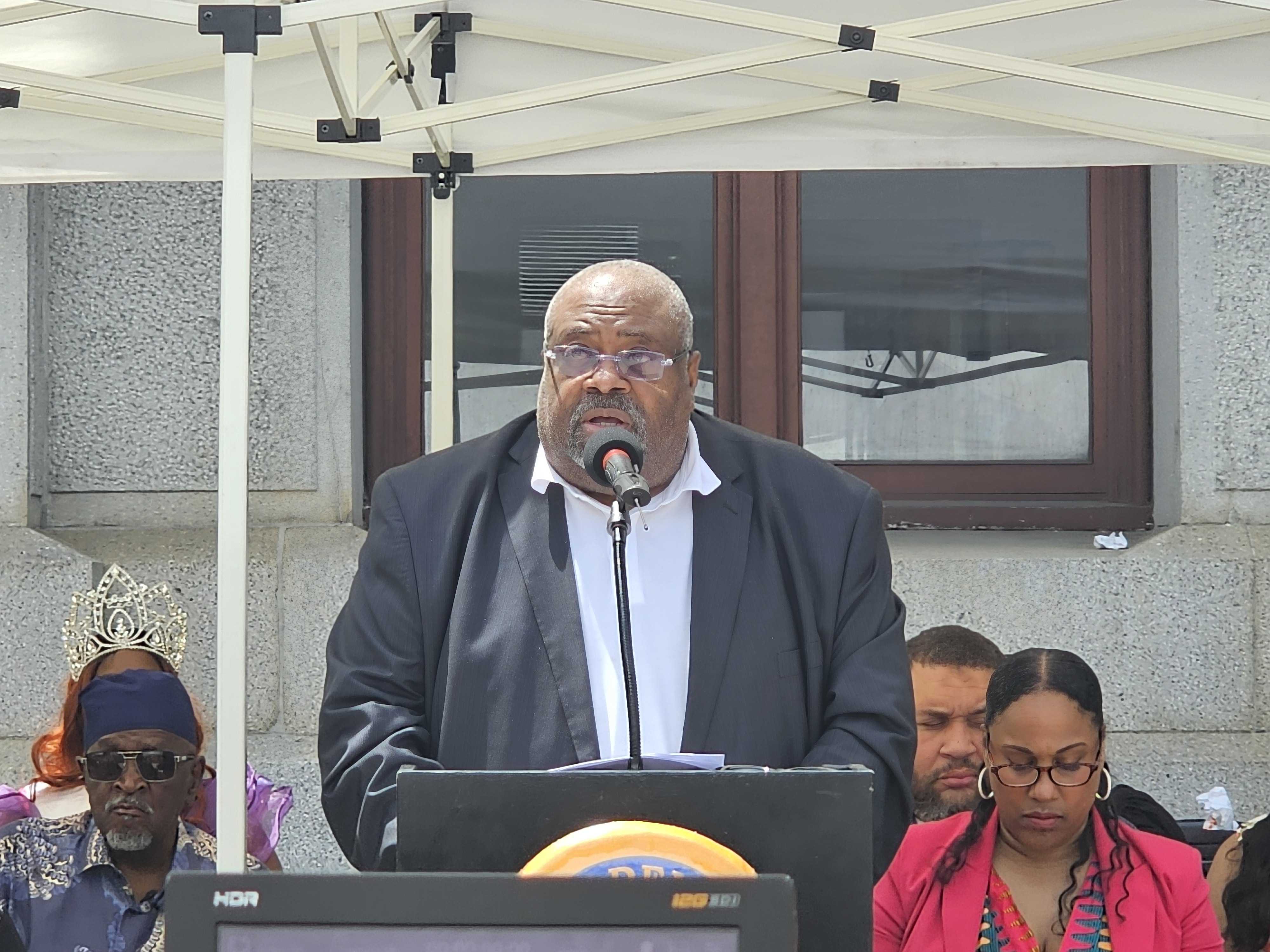 Mark Harrell speaks at a podium