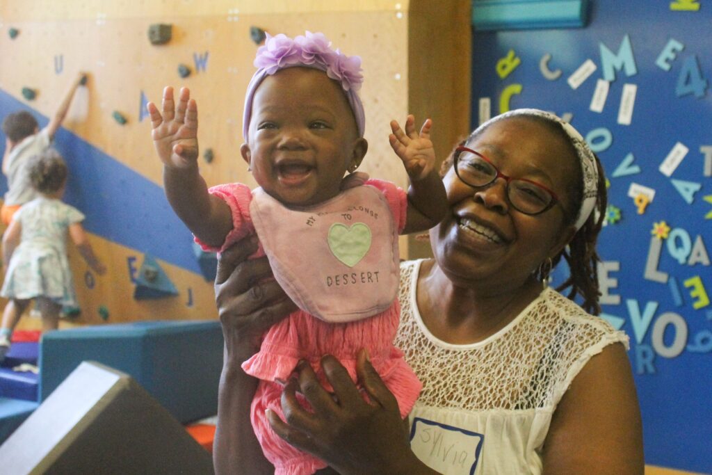 library kids Families and children visit the Cecil B. Moore Library in Philadelphia on Sat., June 22, 2024 to celebrate the launch of the Philly Joy Bank and escape the heat wave at one of the city’s designated cooling centers. (Nicole Leonard/WHYY)