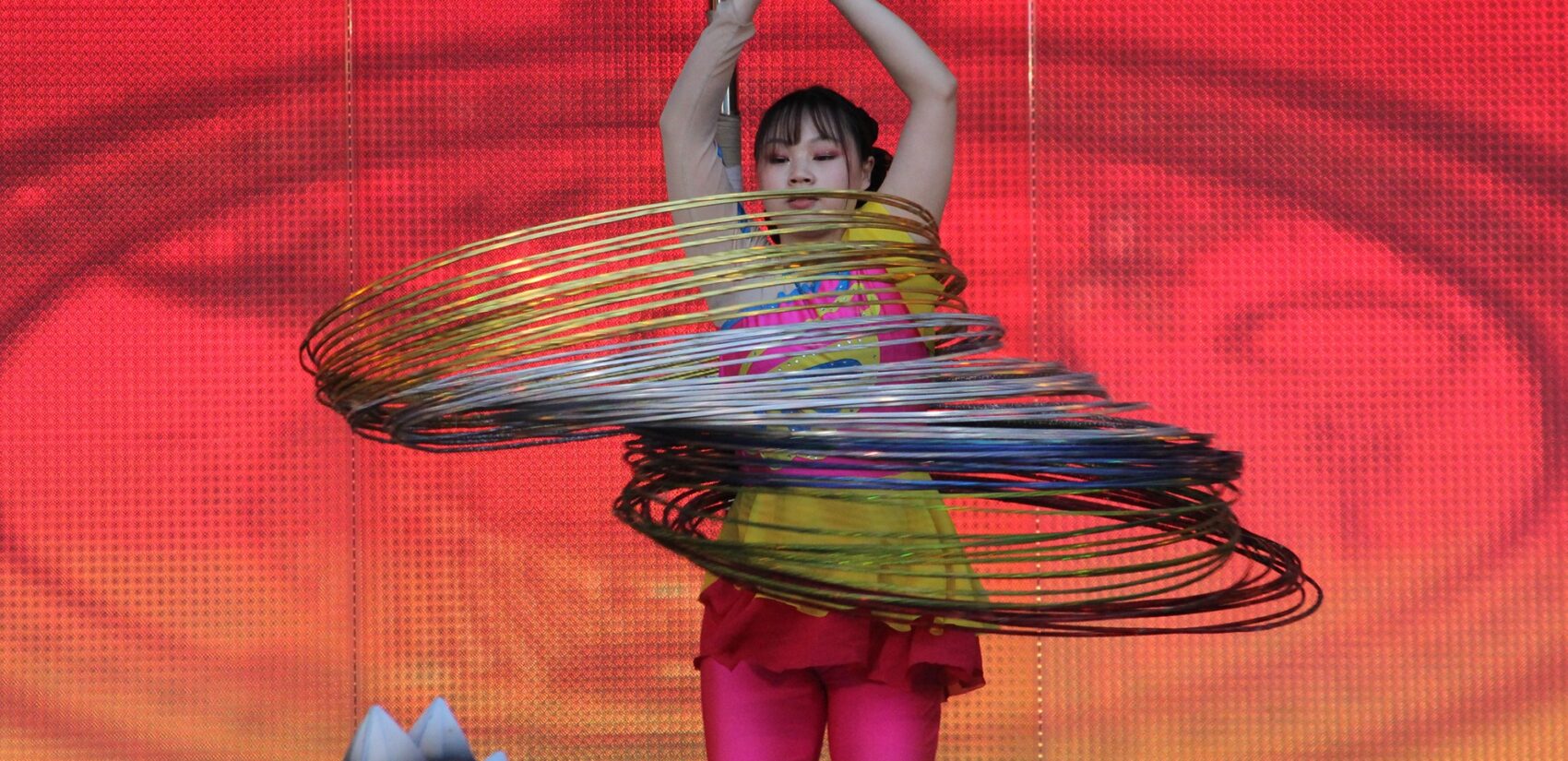 Artistic hula hooping turns what's traditionally a form of exercise into a fantastic display of spins, tricks and, of course, hoops. (Cory Sharber/WHYY)