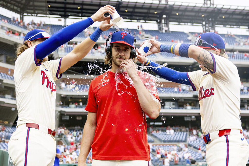 Aaron NolaAlec BohmBryson Stott Philadelphia Phillies starting pitcher Aaron Nola is doused with water by Alec Bohm, left, and Bryson Stot