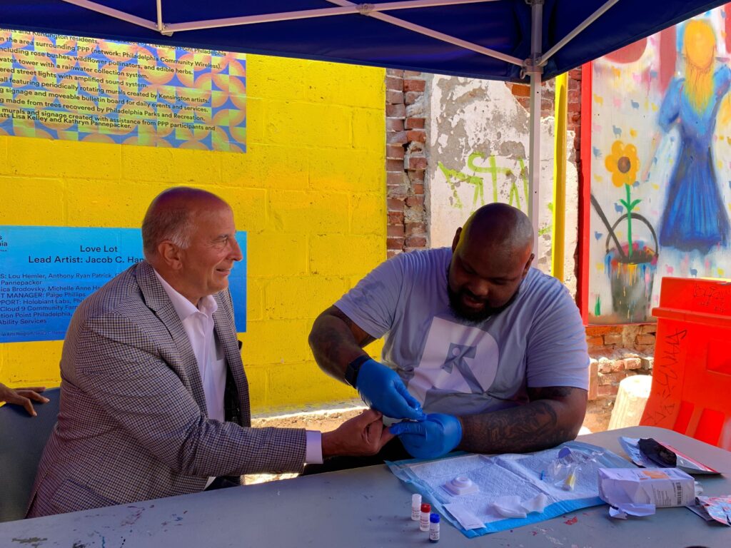 Mark Squillla given a HIV rapid test by Kareem Mims