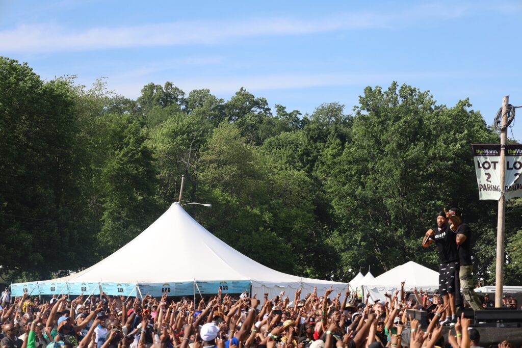 Method Man and Redman performing as the crowd points to the sky