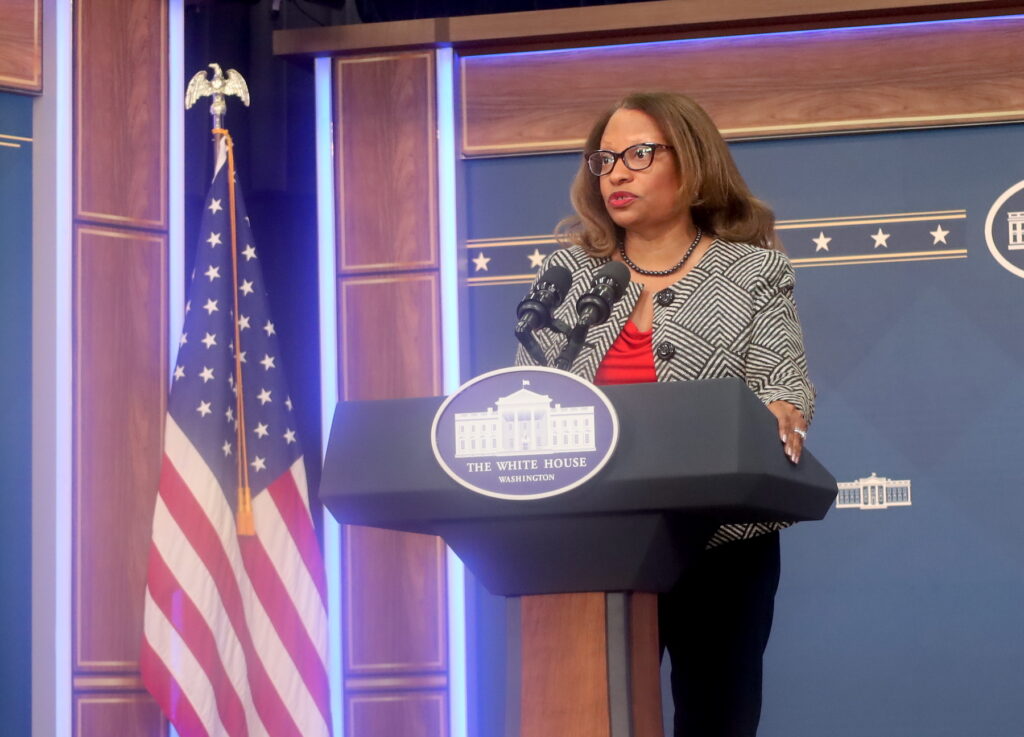 Adrianne Todman speaking at a podium
