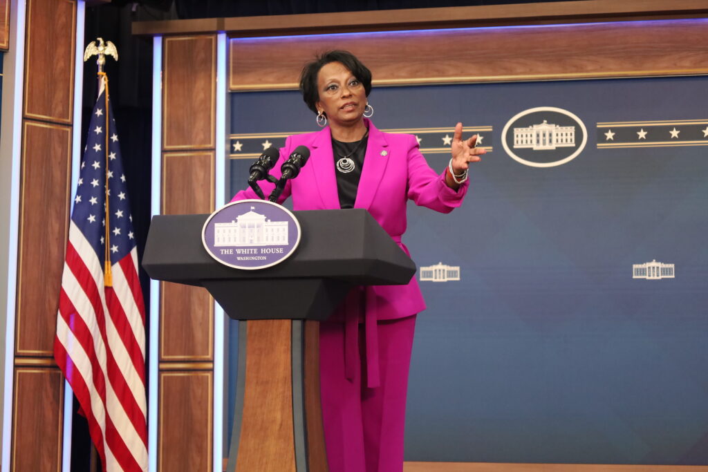 Dietra Trent speaking at a podium
