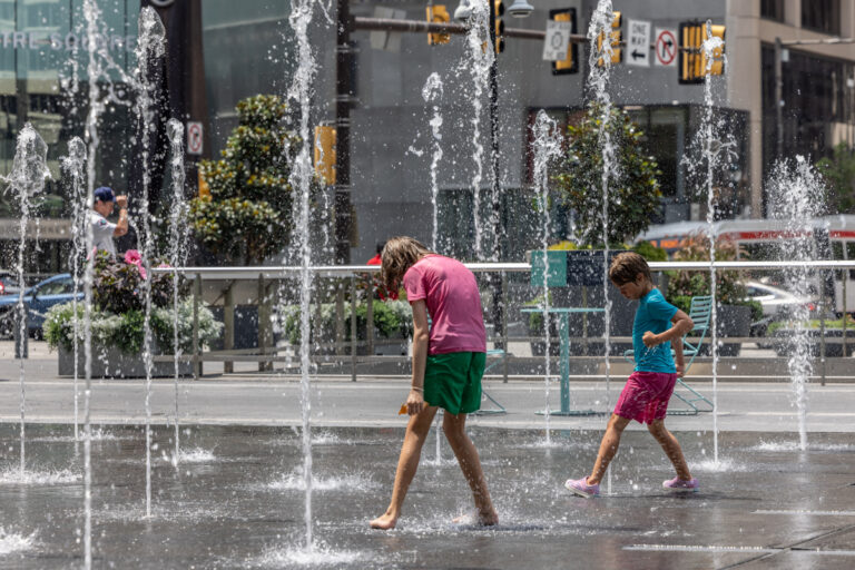 children playing in a sprayground