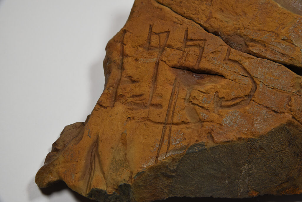 Buckingham Cave Rock Inscription Close-Up (Credit Mercer Museum) A close-up of a rock found inside a cave in Buckingham Township. The