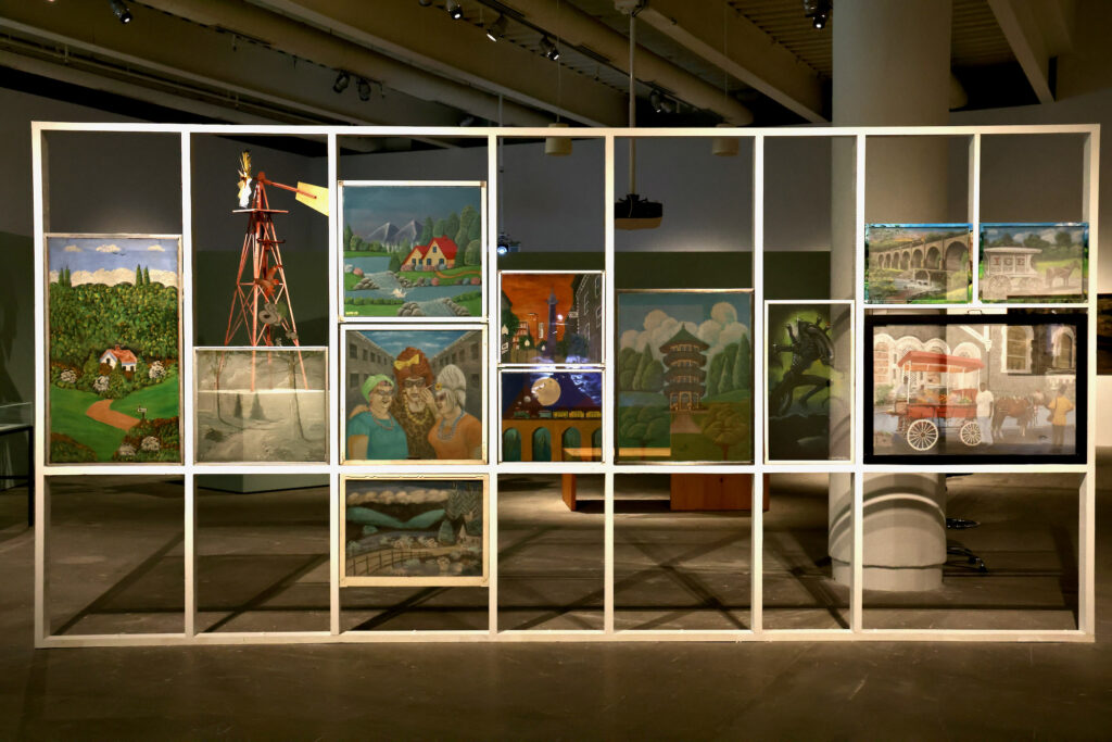 2024 07 11-e lee-philadelphia institute of contemporary art-yard art exhibit painted screens The artists of the Baltimore-based Painted Screen Society created a group of paintiings for the ''Art From the Yard'' exhibit at the Institute of Contemporary Art. The society is dedicated to documenting and preserving the city's tradition of painting mesh screens, which dates back to the early 1900s. (Emma Lee/WHYY)
