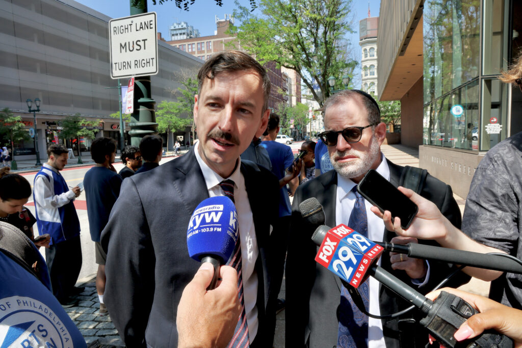 Ryan Allen Hancock and Eric Lechtzin speaking to the media