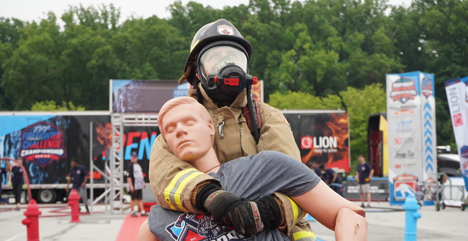 A firefighter dragging a mannequin