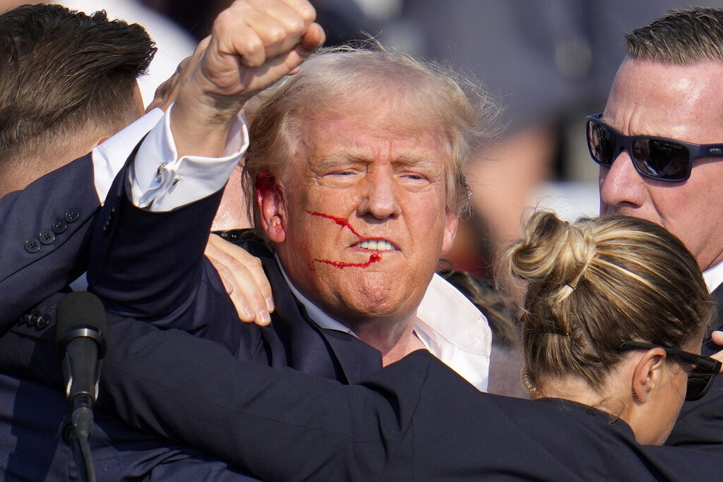 Donald Trump FILE - Republican presidential candidate former President Donald Trump reacts following an assassination attempt at a campaign event in Butler, Pa., on Saturday, July 13, 2024. Trump Media surged in the first day of trading, Monday, July 15, following the assassination attempt. (AP Photo/Gene J. Puskar, File)