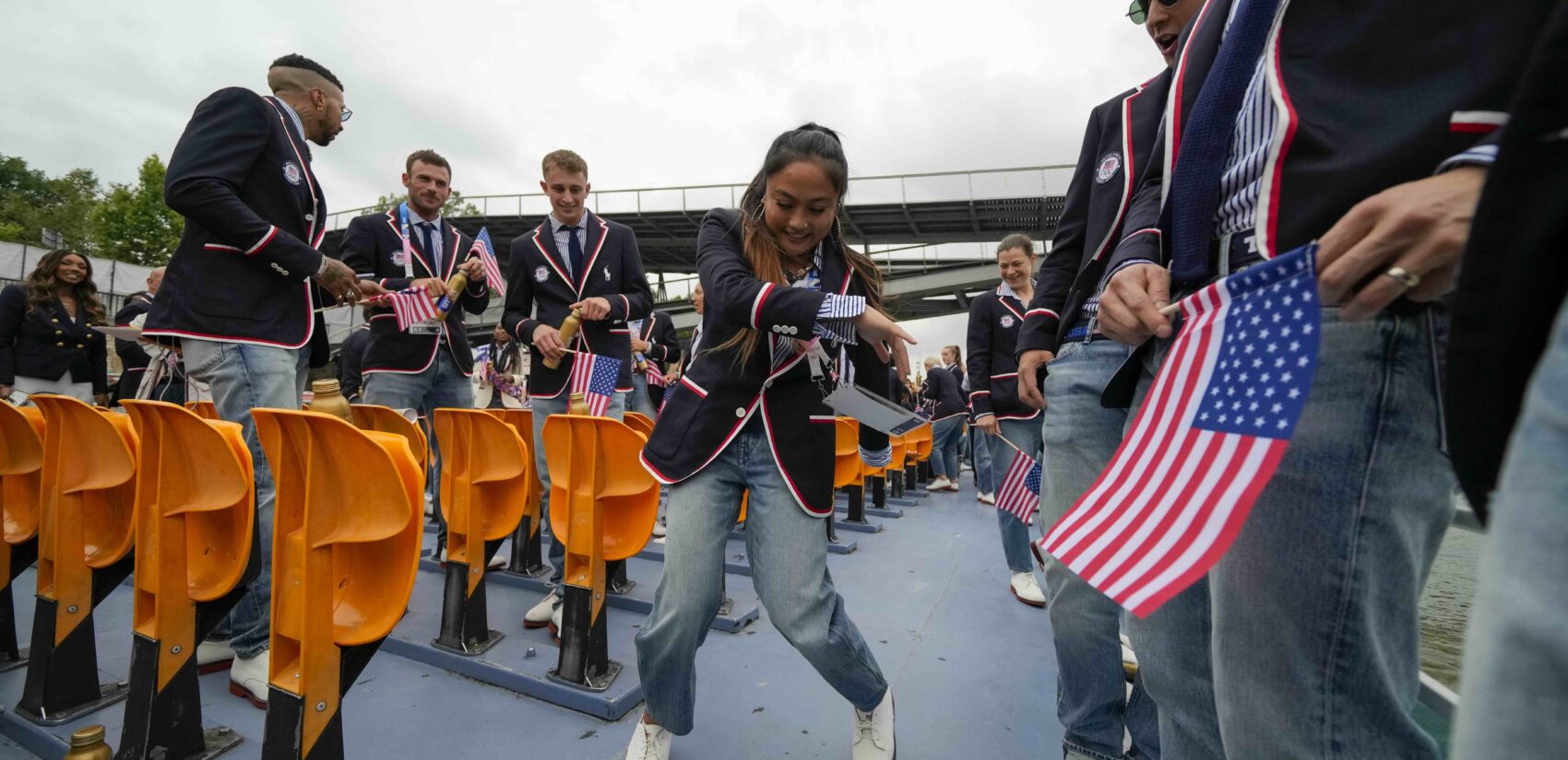 Logan Edra, of the United States breakdancing team, dances as she travels along with teammates on the Seine River in Paris, France, during the opening ceremony of the 2024 Summer Olympics, Friday, July 26, 2024. (AP Photo/Ashley Landis, Pool)