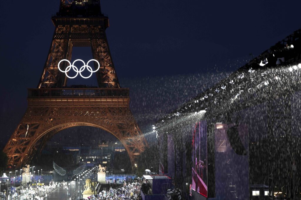 APTOPIX Paris Olympics Opening Ceremony Rain falls in front of the Eiffel Tower, in Paris, France, during the opening ceremony of the 2024 Summer Olympics, Friday, July 26, 2024. (Pascal Le Segretain/Pool Photo via AP)
