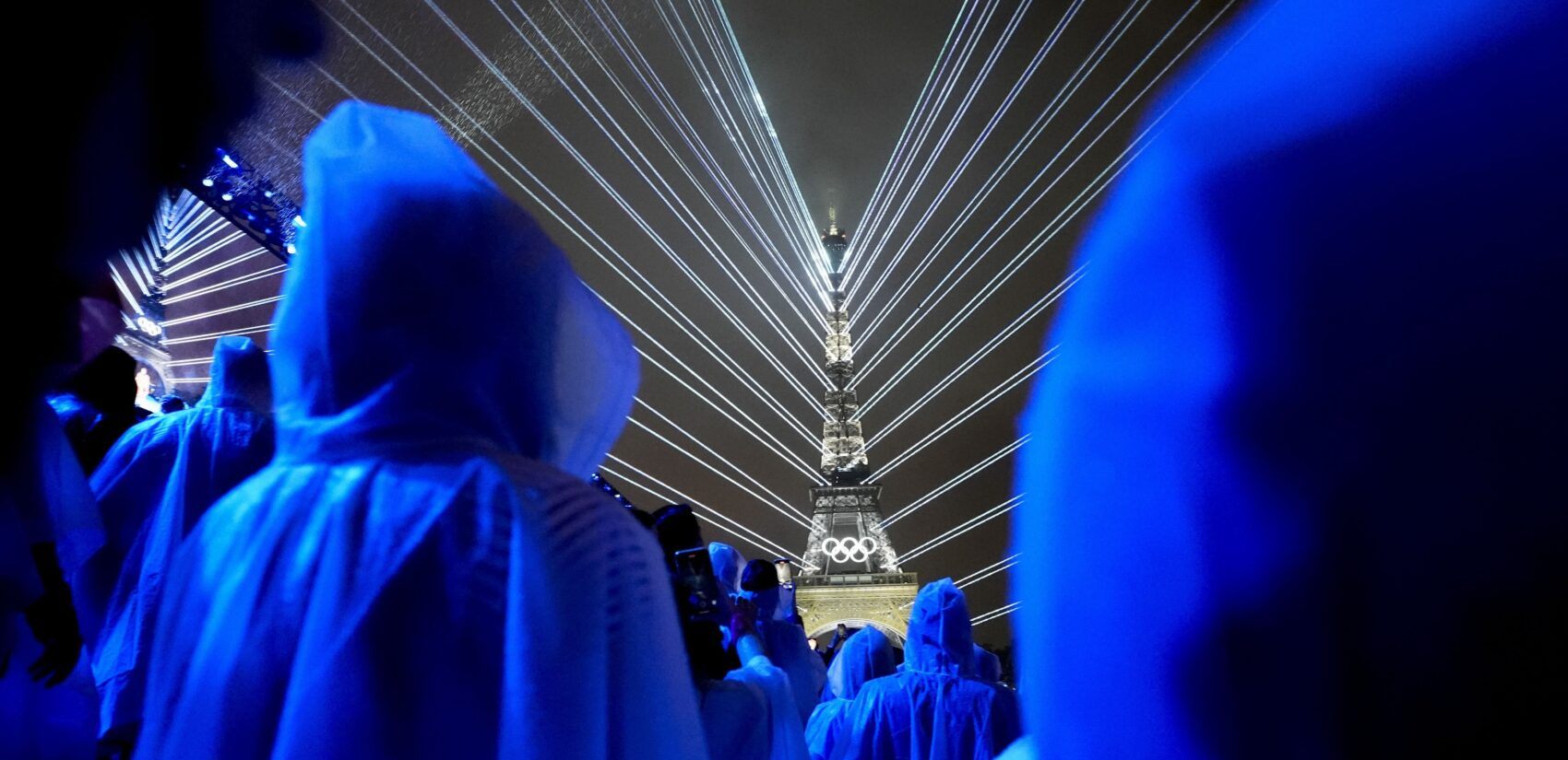 Flashes of lights illuminate the Eiffel Tower in Paris, France, during the opening ceremony of the 2024 Summer Olympics, Friday, July 26, 2024. (AP Photo/Robert F. Bukaty)