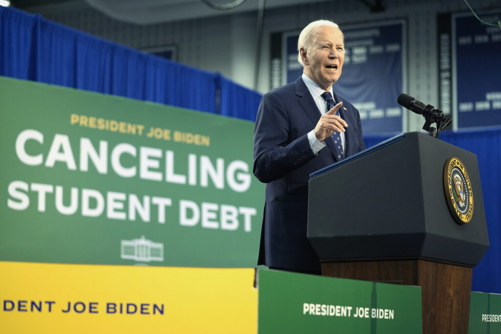 Biden speaking at a podium