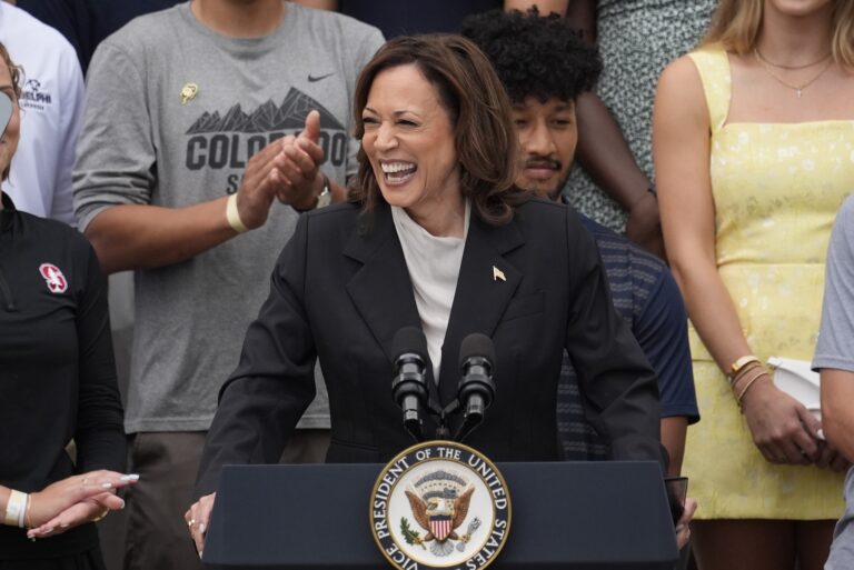 Kamala Harris speaking at a podium