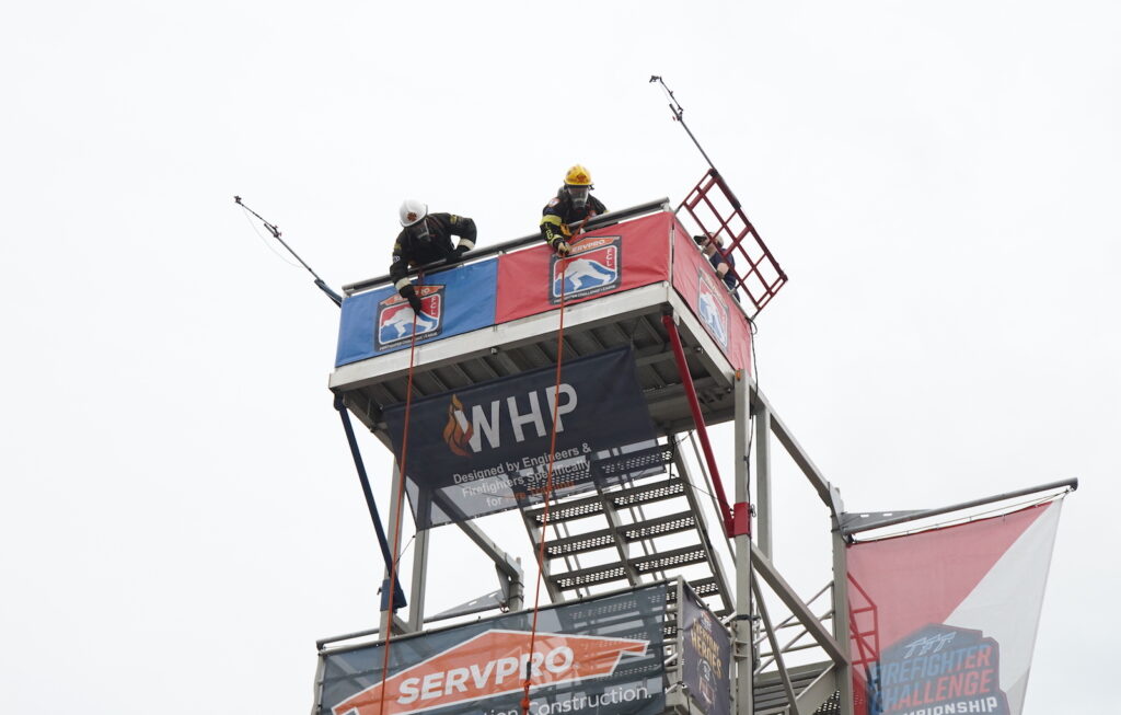 Firefighters on top of the tower