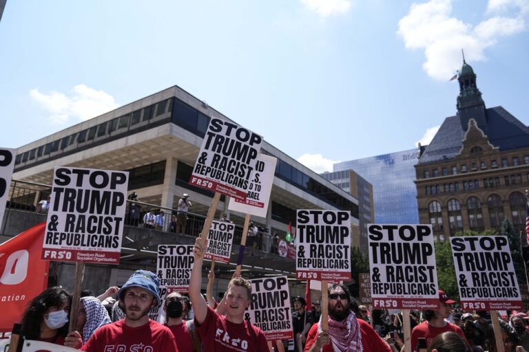 Protestors speak at Red Arrow Park near the Fiserv Forum during the first day of the 2024 Republican National Convention, Monday, July 15, 2024, in Milwaukee. (AP Photo/Jae C. Hong)