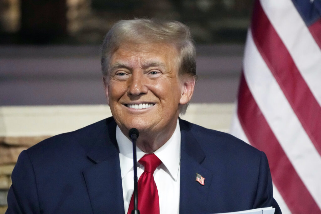 Donald Trump smiling intensely