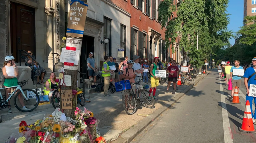 bicyclist-death-philly-DS-072424 People form a ''human-protected bike lane'' on Spruce Street