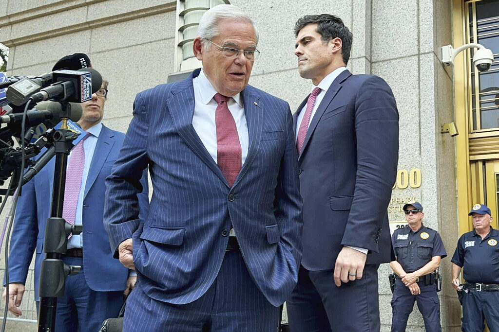 Bob Menendex U.S. Sen. Bob Menendez, D-N.J., center, leaves federal court following the day's proceedings in his bribery trial, Tuesday, July 16, 2024, in New York. Menendez has been convicted of all the charges he faced at his corruption trial, including accepting bribes of gold and cash from three New Jersey businessmen and acting as a foreign agent for the Egyptian government. (AP Photo/Larry Neumeister)