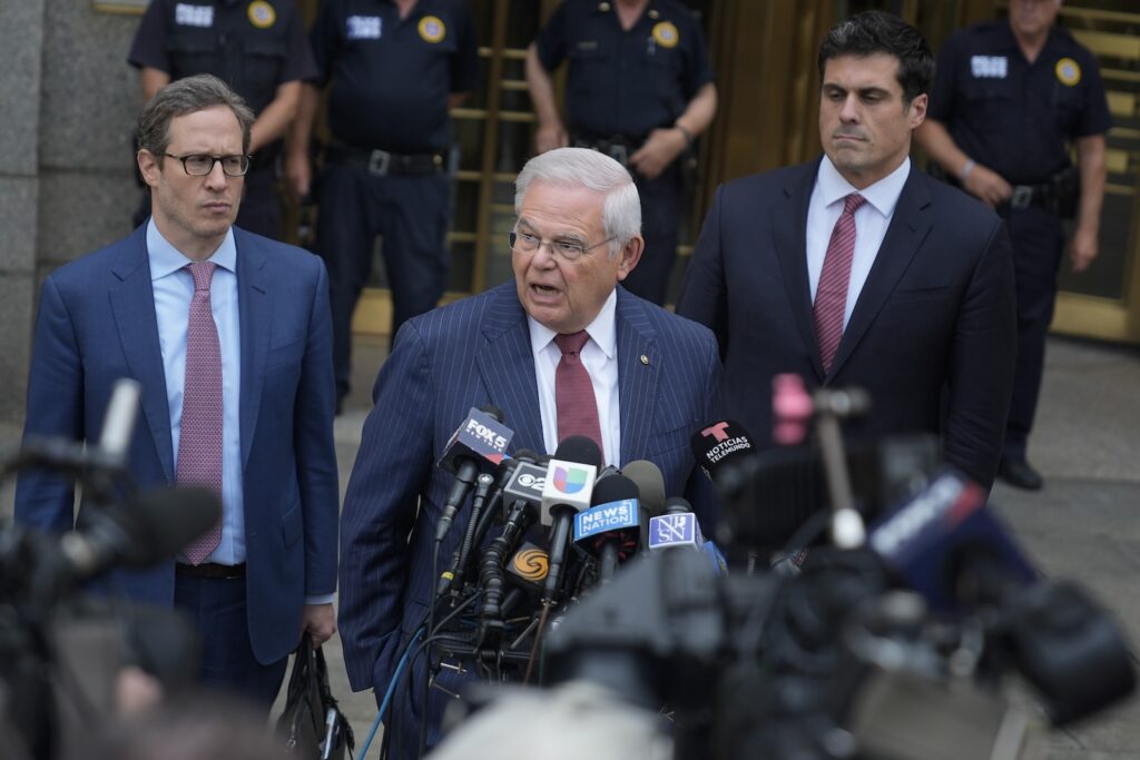 Bob Menendez Sen. Bob Menendez, D-N.J., center, speaks to reporters as he leaves federal court in New York, Tuesday, July 16, 2024.