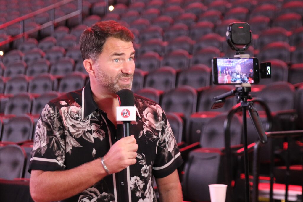 Eddie Hearn speaking into a microphone