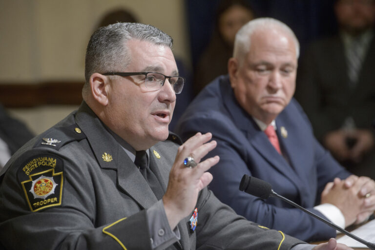 Patrick Yoes, National President, Fraternal Order of Police, right, listens as Colonel Christopher L. Paris, Commissioner, Pennsylvania State Police, left, responds to questions during a House Committee on Homeland Security hearing examining the assassination attempt of July 13, on Capitol Hill, Tuesday, July 23, 2024, in Washington. (AP Photo/Rod Lamkey, Jr.)