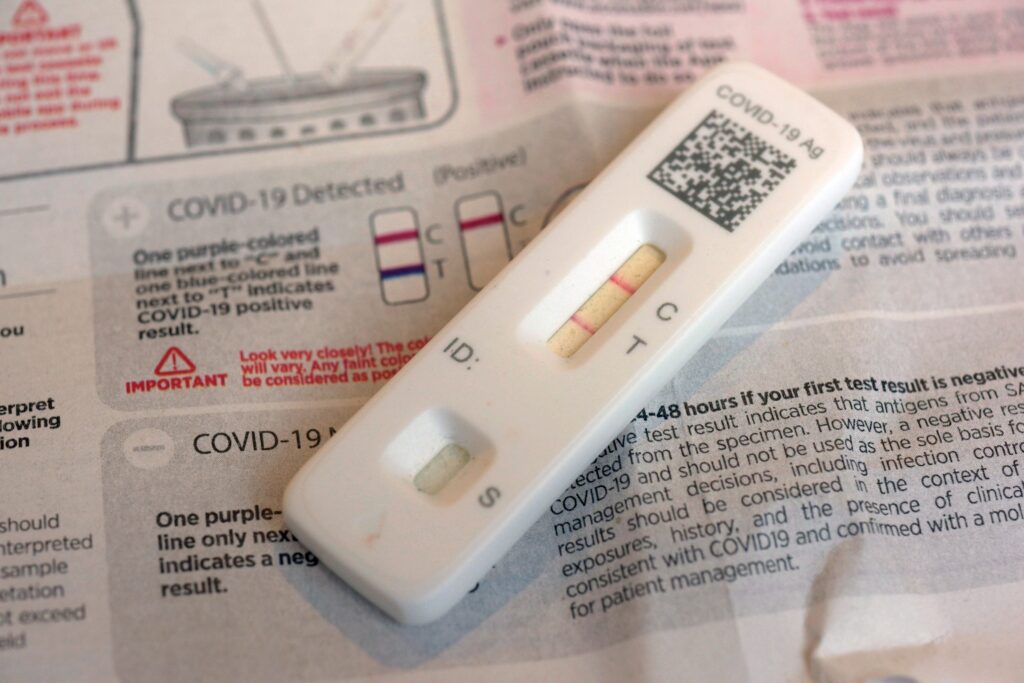 covid-test-file A COVID-19 antigen home test indicating a positive result