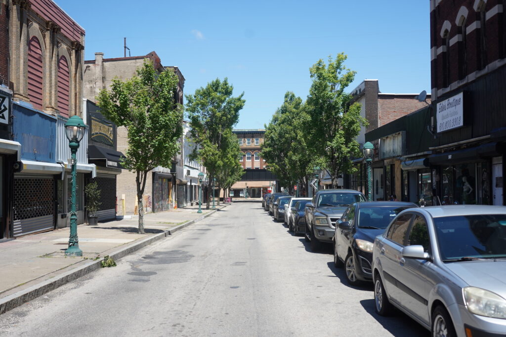 downtown-chester-k-cooper-2024-07-23-5 Looking down a quiet tree-lined street in Chester, Pa.