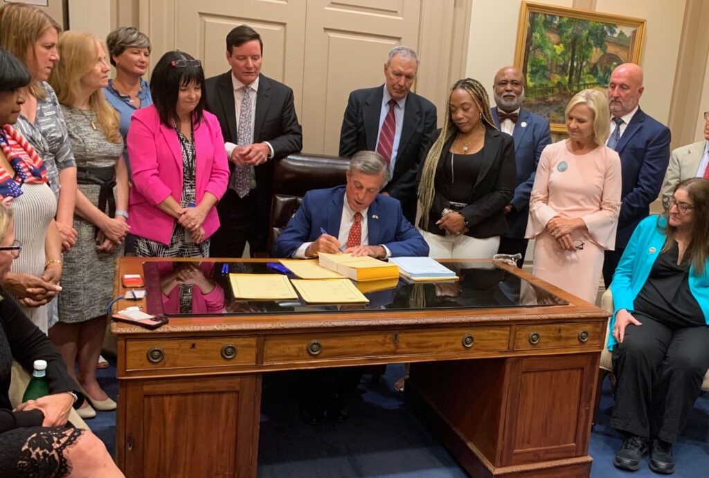 gov-carney-signs-budget-2024-07-01-1 John Carney signing the budget