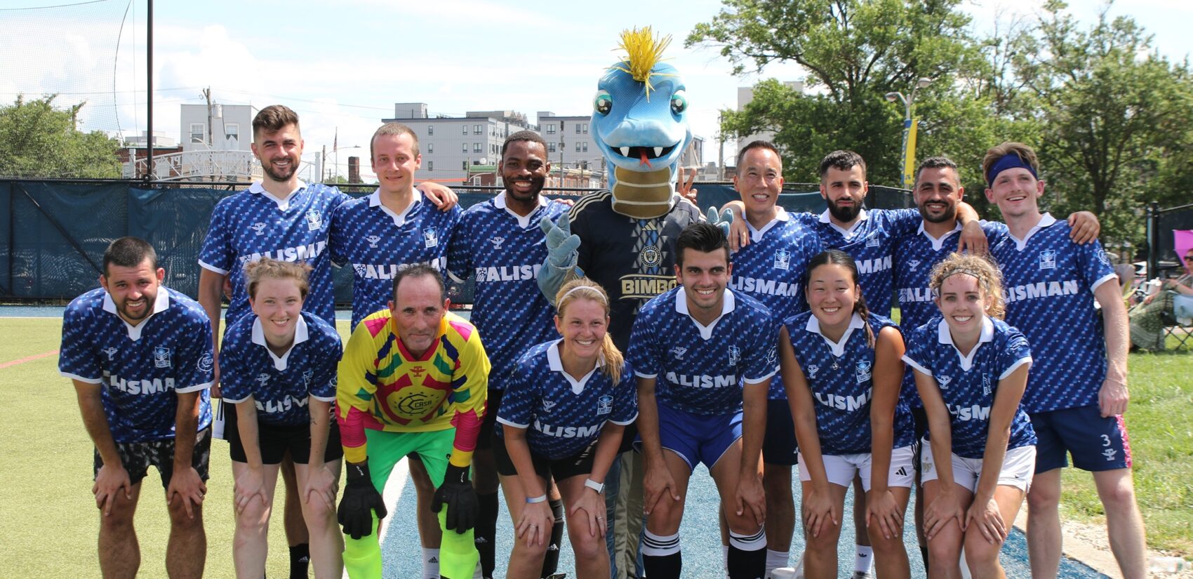 Philadelphia Union mascot Phang (the snake) posed for photos with teams Saturday as the sun beamed down on the Vidas Athletic Complex. (Cory Sharber/WHYY)
