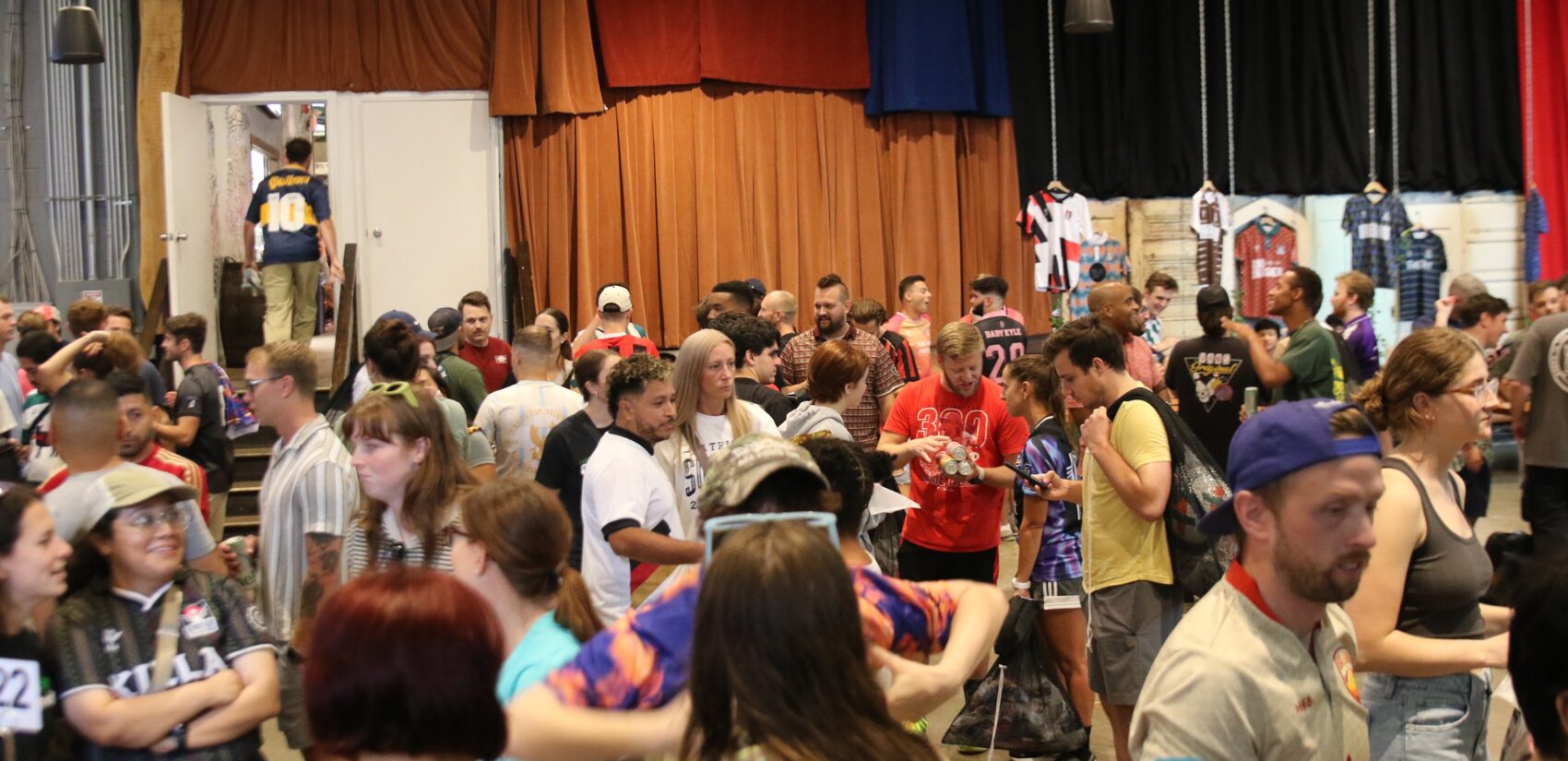 Players picked up their kits and soaked up the vibes during a pre-tournament gathering at Craft Hall on Friday. (Cory Sharber/WHYY)