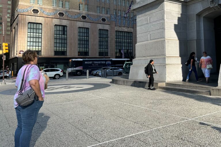 Philadelphia employees head into the office the morning of a massive technology outage affecting Microsoft products. Some leave the building after commuting to work. (Kristen Mosbrucker-Garza/WHYY News)