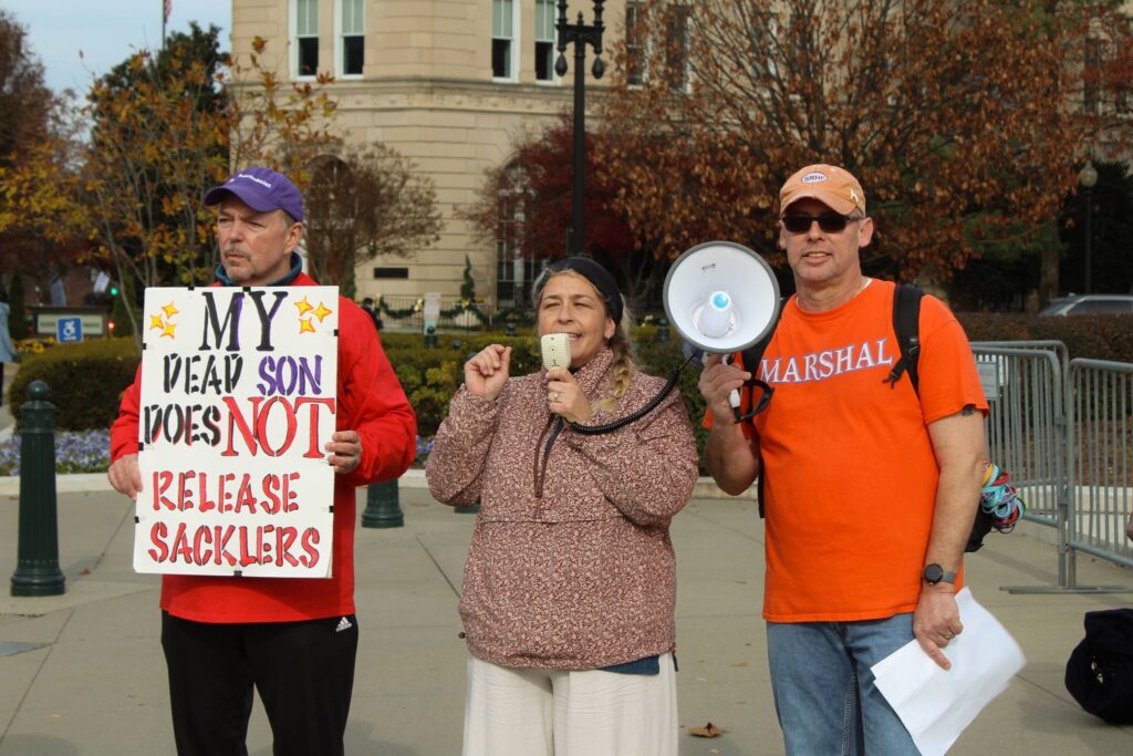 Susan Ousterman and two others at a protest