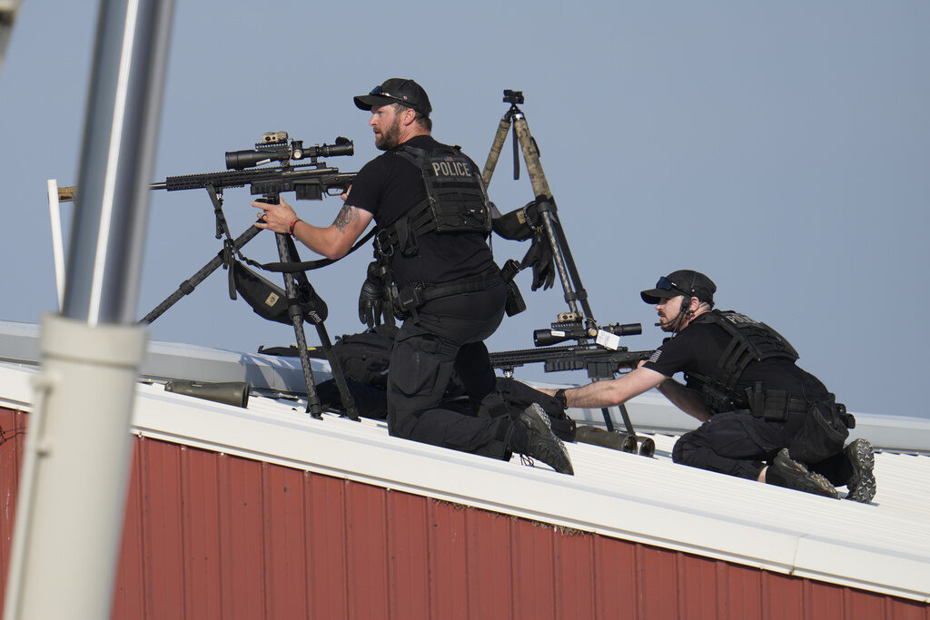 Election 2024 Trump Police snipers return fire after shots were fired while Republican presidential candidate former President Donald Trump was speaking at a campaign event in Butler, Pa., on Saturday, July 13, 2024. (AP Photo/Gene J. Puskar)