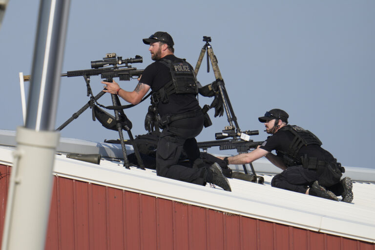 Police snipers return fire after shots were fired while Republican presidential candidate former President Donald Trump was speaking at a campaign event in Butler, Pa., on Saturday, July 13, 2024. (AP Photo/Gene J. Puskar)
