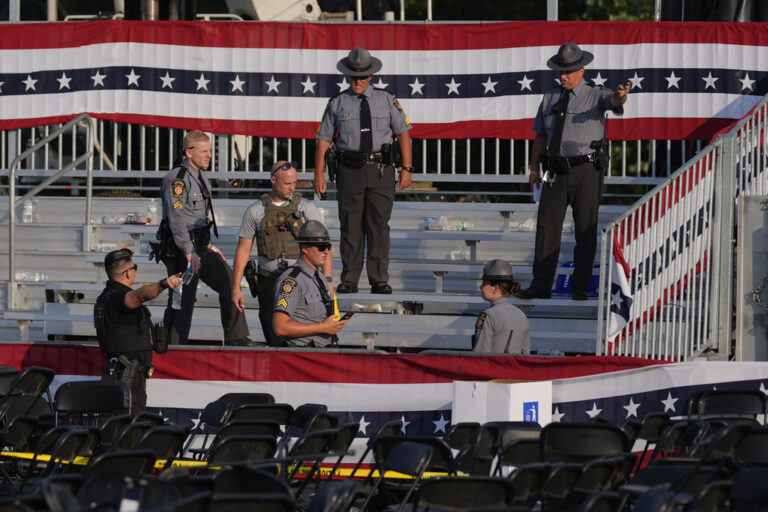 Law enforcement officers gather at the campaign rally site for Republican presidential candidate former President Donald Trump  Saturday, July 13, 2024, in Butler, Pa. (AP Photo/Evan Vucci)