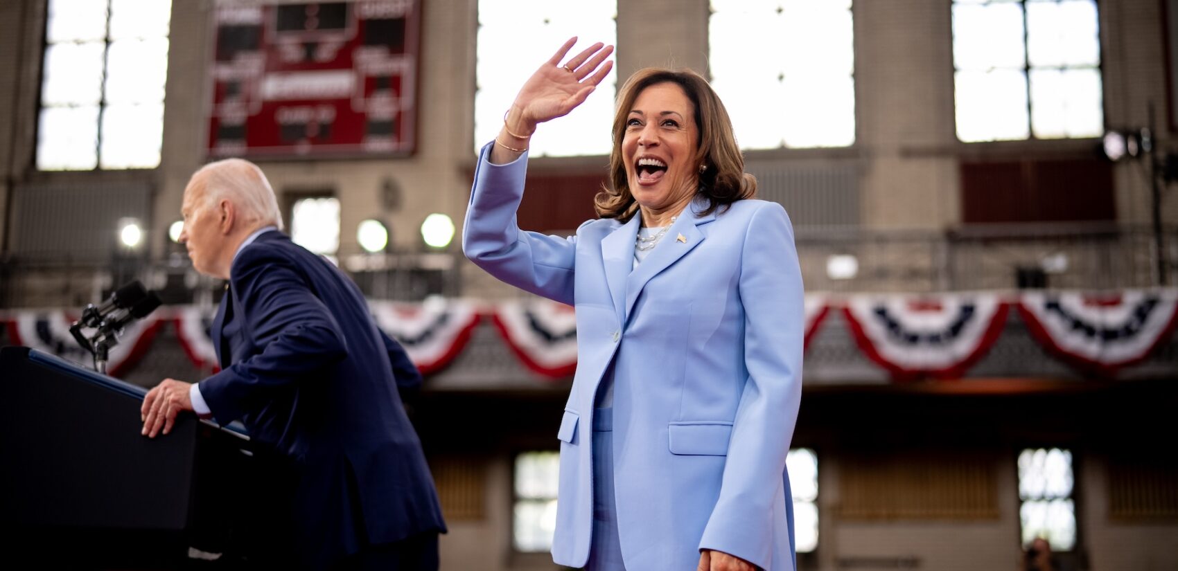 VP Harris waving to the crowd as Joe Biden introduces her