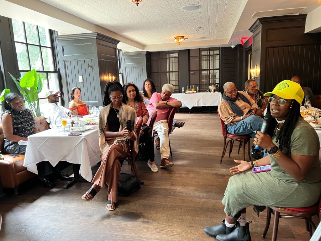 Tamara Russell speaks to the audience at the Pride Brunch