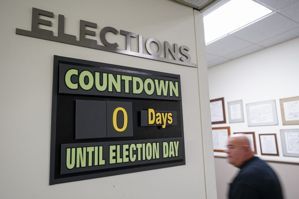 Lehigh Valley Primary Election Day 2024 A man walks past a sign that reads