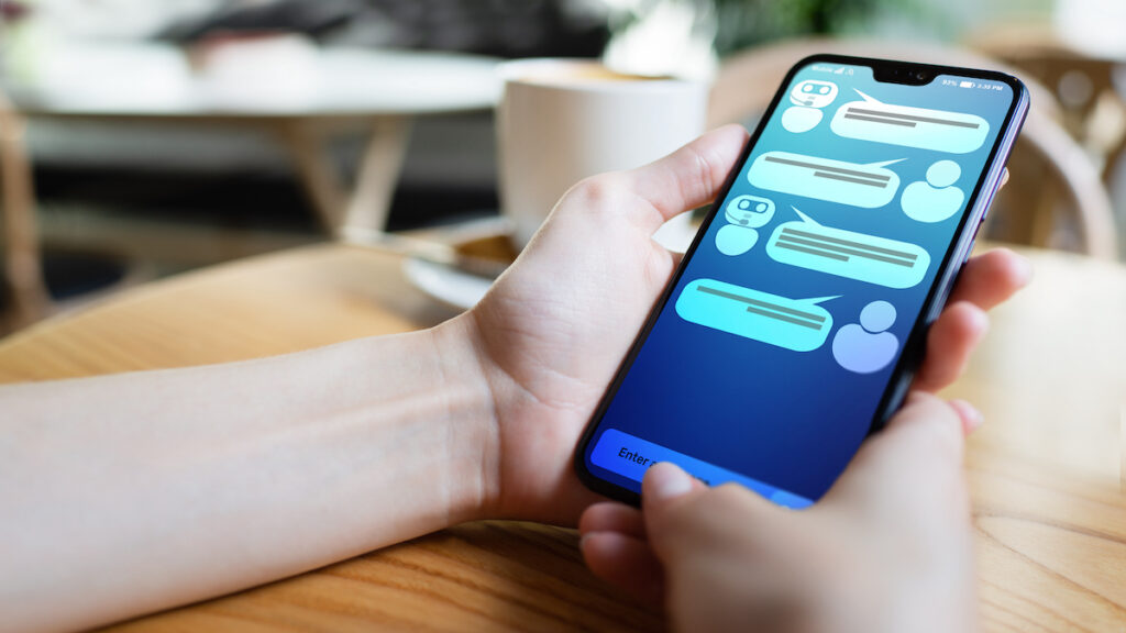 Customer And Chatbot Dialog On Smartphone Screen. Ai. Artificial Intelligence And Service Automation AI chatbot dialog on smartphone screen. (Bigstock/Wrightstudio)
