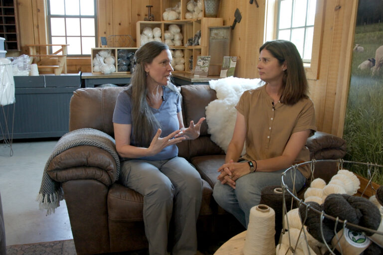 Susan Phillips sits and talks with Melissa Smith