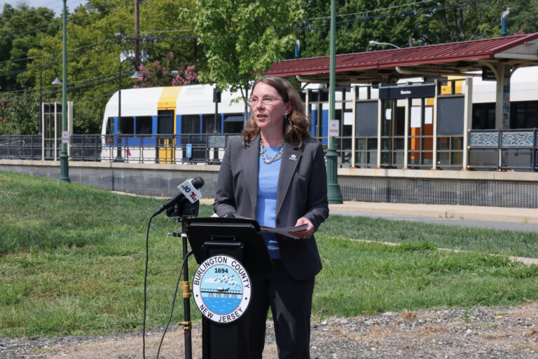 Allison Eckel speaks behind a podium